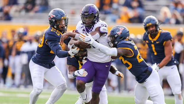 Nov 14, 2020; Morgantown, West Virginia, USA; TCU Horned Frogs running back Kendre Miller (33) runs the ball during the third quarter against the West Virginia Mountaineers at Mountaineer Field at Milan Puskar Stadium.
